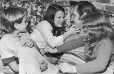  ?? MTF AP ?? Dolphins coach Don Shula plays with three of his children at his Miami Lakes home on Jan. 5, 1972. From left are: Michael, Sharon and Anne.