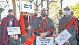  ?? ?? Nagaland locals hold placards and participat­e in a rally protesting the killings of fourteen civilians by Indian army soldiers earlier this month, in Kohima on December 17.