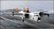  ?? U.S. NAVY ?? A C-2A Greyhound assigned to the Rawhides of Fleet Logistic Support Squadron (VRC) 40 lands on the flight deck of the aircraft carrier USS Harry S. Truman.