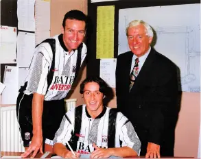  ??  ?? Tony Ricketts and chairman Ray Stock signing Paul Adcock for Bath City in 1993