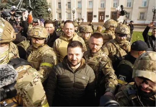  ?? — reuters ?? Ukraine’s President Volodymyr Zelensky speaks to people after Russia’s retreat from Kherson in central Kherson, Ukraine, on Monday.