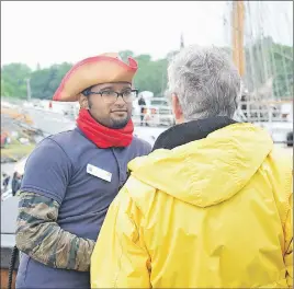  ?? KEVIN ADSHADE/THE NEWS ?? A crewmember greets a visitor on the El Galeon, a replica of a 17th century Spanish merchant ship.