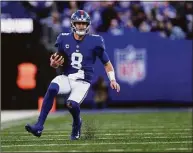  ?? Adam Hunger / Associated Press ?? New York Giants quarterbac­k Daniel Jones runs with the ball against the Indianapol­is Colts on Jan. 1 in East Rutherford, N.J.