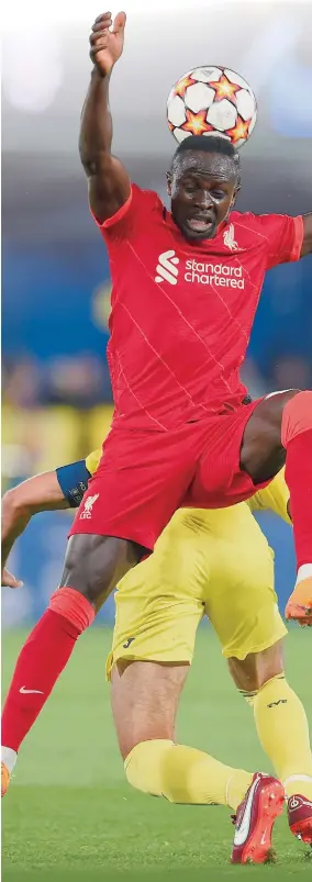  ?? Photo: VCG ?? Sadio Mane of Liverpool competes for a header during the UEFA Champions League semifinal second- leg match between Villarreal and Liverpool at Estadio de la Ceramica on May 3, 2022 in Villarreal, Spain.