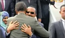  ?? PICTURE: ERITV/AP ?? In this video grab provided by ERITV, Ethiopian Prime Minister Abiy Ahmed, background centre, is welcomed by Eritrea’s President Isaias Afwerki after he disembarke­d from an aircraft in Asmara, Eritrea yesterday.