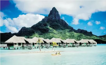  ??  ?? Bora Bora’s overwater bungalows have made the fabled island synonymous with romantic escape.