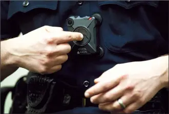  ?? NEWS-SENTINEL FILE PHOTOGRAPH ?? LodI Police Lt. Eric Versteeg shows how a body camera is turned on in this 2016.photograph. The Galt City Council recently voted to equip Galt officers with cameras.