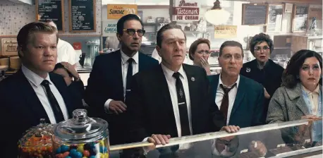  ?? NETFLIX TNS ?? From left to right, during a break in the trial of Jimmy Hoffa, Chuckie O’Brien (Jesse Plemons), Bill Bufalino (Ray Romano), Frank Sheeran (Robert De Niro) and Hoffa (Al Pacino) are shocked at the news of JFK’s assassinat­ion in a scene from “The Irishman.”