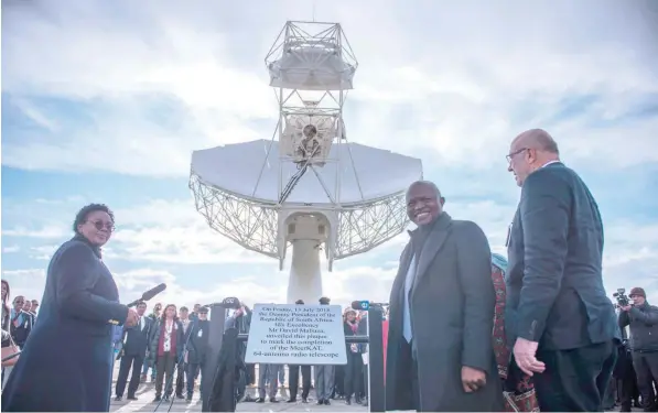  ?? — AFP ?? South African Deputy President David Mabuza (2nd R) officially inaugurate­s one of a 64-dish radio telescope system during an official unveiling ceremony on Friday in Carnarvon.