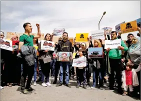  ?? REUTERS ?? People attend a protest against American airstrikes in Syria, in front of the United Nations (UN) building in Damascus, Syria on 8 April.