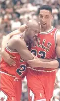  ?? AP ?? An ailing Michael Jordan falls into Scottie Pippen’s arms during Game 5 of the 1997 NBA Finals. Jordan scored 38 points in the Bulls’ 90-88 victory.