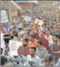  ??  ?? People stage a protest against nullificat­ion of Articles 370 in Srinagar on August 23, 2019 .