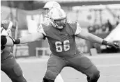  ??  ?? Stetson offensive lineman and Bishop Moore alum Brad Alexander (66) looks to make a block against Drake.