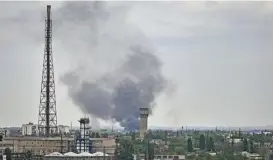  ?? (AFP) ?? Smoke rises during shelling in the city of Severodone­tsk, eastern Ukraine on Saturday