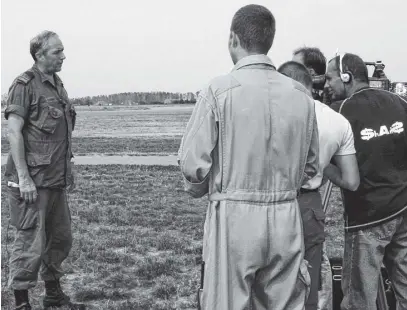  ?? ?? Maj. Dunne being interviewe­d in 2001 by a Russian TV news team about NATO’S Exercise Cooperativ­e Key at the Plovdiv press centre, Bulgaria, in the days following 9/11.