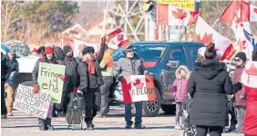  ?? GEOFF ROBINS AFP/GETTY IMAGES ?? Protesters block the Ambassador Bridge in Windsor. It looks like people who have the freedom to lay siege on the capital feel they’re more hard done by than other Canadians, Shree Paradkar writes.