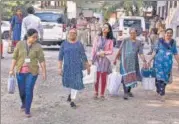  ?? PTI ?? Polling officials with EVMs and other equipment leave for their polling stations ahead of the first phase of Gujarat elections.