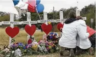  ?? Bob Owen / San Antonio Express-News ?? Family members on Friday mourn Karen and Robert Scott Marshall, two of the 26 victims of the massacre at First Baptist Church in Sutherland Springs.