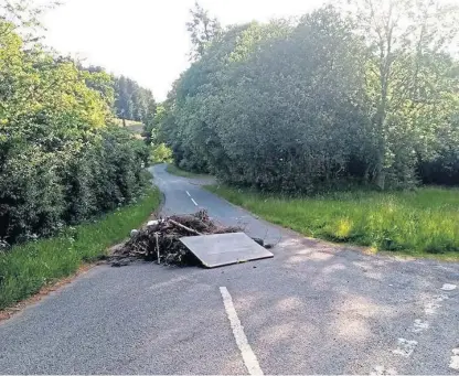  ??  ?? Perthshire man Alistair McNab saw the fly-tipped pile of rubbish in the road as he drove to work.