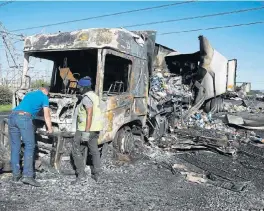  ?? /Esa Alexander ?? Flaming protest: Two trucks, said to be carrying goods for supermarke­ts, were set alight on the N1 highway near Cape Town on Wednesday, during a strike related to unhappines­s about the employment of foreigners in the trucking industry. Protests started across the country on Tuesday with several roads being barricaded.