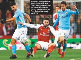  ??  ?? Arsenal’s Sead Kolasinac (centre) vies with Man City’s Sergio Aguero and Bernardo Silva (right) during Sunday’s League Cup final at Wembley. – AFPPIX