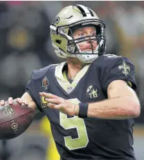  ?? Chris Graythen / Getty Images ?? Saints quarterbac­k Drew Brees mastermind­s an offense that finds ways to pull out victories.