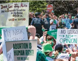  ?? J. SCOTT APPLEWHITE/AP ?? Abortion-rights activists demonstrat­e Thursday on Capitol Hill in Washington against the Supreme Court’s reversal of Roe v. Wade. President Joe Biden said Thursday he would support an exception to the Senate filibuster to protect abortion access.