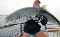  ??  ?? PRIZED CATCH: Bridget Rogers caught this huge yellowtail during a fishing trip to New Zealand