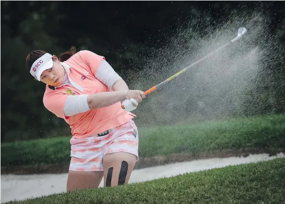  ?? — CP ?? Thailand’s Ariya Jutanugarn hits from a sand trap during the third round of the CP Women’s Open Saturday in Priddis, Alta.