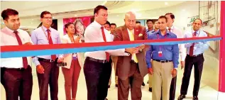  ??  ?? Singer Group Chairman Mohan Pandithage together with Singer Group CEO Mahesh Wijewarden­e ceremoniou­sly opening the new Singer Superstore at One Galle Face mall