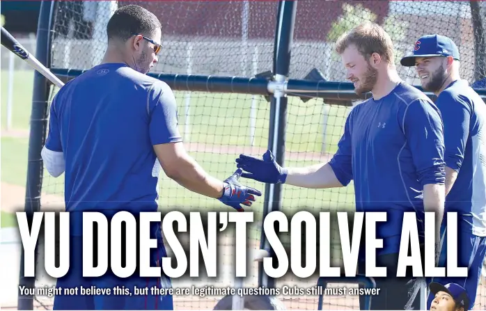  ?? | JOHN ANTONOFF PHOTOS/ FOR THE SUN- TIMES ?? Catcher Willson Contreras ( left) and utility player Ian Happ shake hands at the Cubs’ training complex Monday in Mesa, Ariz.