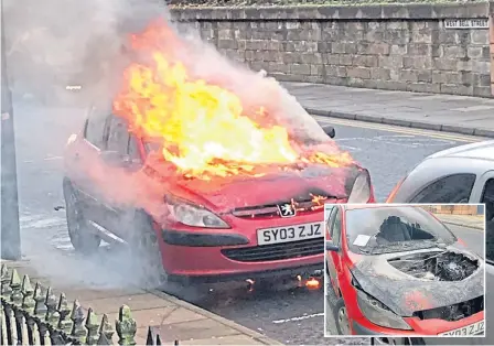  ??  ?? The Peugeot burst into flames in Bell Street – and then had a ticket placed on the windscreen.