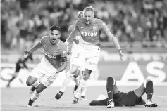  ??  ?? Monaco’s Colombian forward Radamel Falcao (L) celebrates after scoring his second goal during the French L1 football match between Monaco (ASM) and Marseille (OM) on August 27, 2017, at the Louis II Stadium in Monaco.- AFP photo