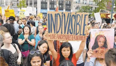  ?? JEFFERSON SIEGEL/DAILY NEWS ?? Hundreds of people (above) take to Foley Square Tuesday to protest after the Supreme Court (below) voted 5-4 to uphold the travel ban, giving a huge victory to President Trump (left).