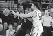  ?? MARCIO JOSE SANCHEZ/AP PHOTO ?? Zaza Pachulia of the Warriors, right, defends against LaMarcus Aldridge of the Spurs in Tuesday’s NBA playoff game at Oakland.