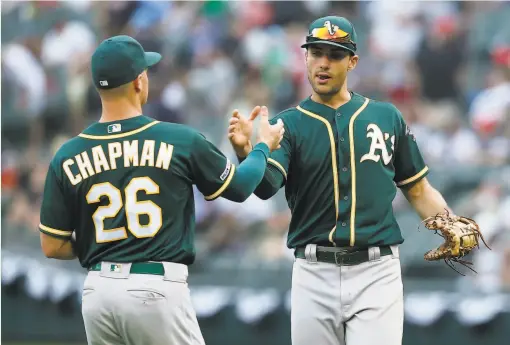  ?? Nuccio DiNuzzo / Getty Images 2019 ?? Above, infielders Matt Chapman and Matt Olson helped the A’s to 97 victories and wildcard appearance­s in each of the past two seasons. Below, the Giants and Farhan Zaidi, president of baseball operations, will embark on a shortseaso­n campaign with a new manager in Gabe Kapler.