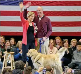  ?? STUART CAHILL / HERALD STAFF FILE ?? BIRTHDAY GIRL: Democratic presidenti­al candidate Sen. Elizabeth Warren, in January with husband, Bruce Mann, and dog Bailey, and at the Black Economic Alliance Forum in Charleston, S.C., last week, below, will turn 70 on Saturday.