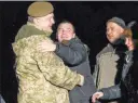  ?? Mikhail Palinchak ?? The Associated Press Ukrainian President Petro Poroshenko, left, greets prisoners who were released by separatist­s Wednesdsay in Kramatorsk, Ukraine.