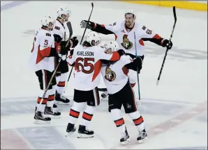  ?? AP PHOTO/FRANK FRANKLIN II ?? Ottawa Senators' Mark Stone (61) and Erik Karlsson (65) celebrate with teammates during the third period of Game 6 of an NHL hockey Stanley Cup second-round playoff series, Tuesday, in New York.