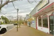  ?? LEA SKENE/AP ?? Downtown Ridgely sits empty March 15. Ridgely’s police department has been suspended by the state, fueling a rumor mill in the town with 1,600 residents.