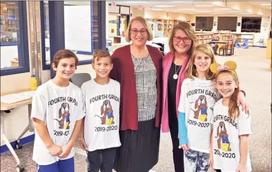  ?? Contribute­d photos ?? Diane Nason, right, presents at a Board of Education meeting with her students and colleague, Lee Morgan. Nason was a fourth grade teacher at Huckleberr­y Hill Elementary School in Brookfield, who died after a battle with cancer. Below, Nason, dresses up as a triplet for Twins Day with former colleague Claire Burch and colleague Stephanie Lounsbury.