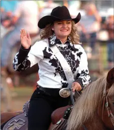  ?? MIKE CAPSHAW ENTERPRISE-LEADER ?? Loran Lopez waves to the crowd while riding in the grand entry. The 20-year-old from Booneville was crowned queen during the 63rd Annual Lincoln Riding Club Rodeo on Saturday, June 11.