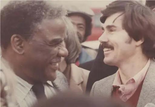  ?? SUN-TIMES FILES ?? Harold Washington laughs with David Orr in a photo taken around 1983. Orr retired Friday as Cook County clerk.