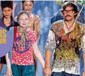  ??  ?? British fashion designer Vivienne Westwood acknowledg­es the public with her husband Andreas Kronthaler.