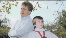  ?? PICTURES: ABOVE, TIME IRELAND/PA, TOP, YUI MOK/PA ?? YEARS OF SUCCESS: Singer Aled Jones, top, and above, posing with a photo of a much younger version of himself.