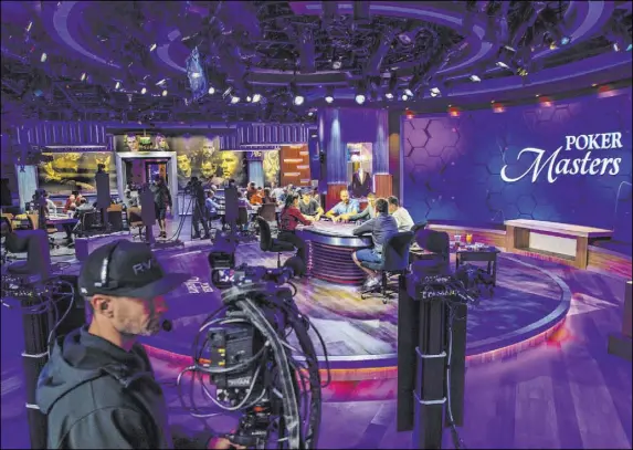  ?? L.E. Baskow Las Vegas Review-Journal @Left_Eye_Images ?? The main table of the 2019 Poker Masters competitio­n is broadcast live Nov. 11 in the PokerGO Studio at the Aria hotel-casino.