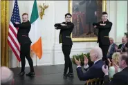  ?? ASSOCIATED PRESS FILE PHOTO ?? President Joe Biden and first lady Jill Biden watch
Irish dance group Cairde perform at a St. Patrick’s Day celebratio­n in the East Room of the White House, March 17, 2022, in Washington.