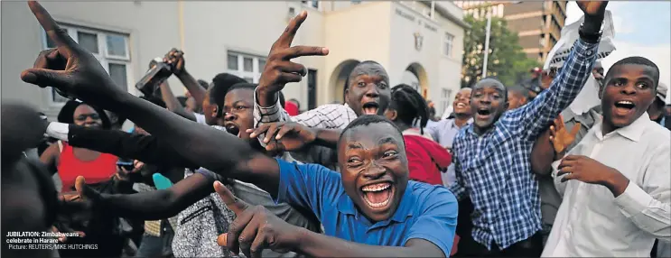  ?? Picture: REUTERS/MIKE HUTCHINGS ?? JUBILATION: Zimbabwean­s celebrate in Harare