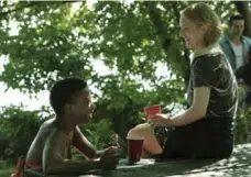  ?? GEORGE KRAYCHYK/HULU ?? Moira (Samira Wiley), left, and Offred (Elisabeth Moss) in The Handmaid’s Tale, the new series based on the 1985 novel by Margaret Atwood.