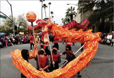  ?? XINHUA ?? People perform a dragon dance during the Riverside Lunar Festival in Riverside County, California, in the United States, on Jan 29.